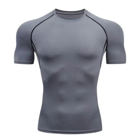 Camisa de compressão masculina cinza com costura preta, tecido dry fit elástico para treino intenso e suporte muscular